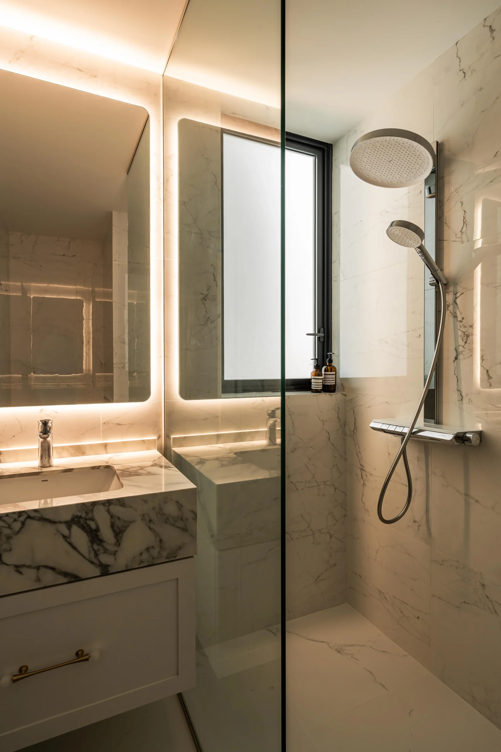 modern bathroom with ambient lighting and marble surfaces