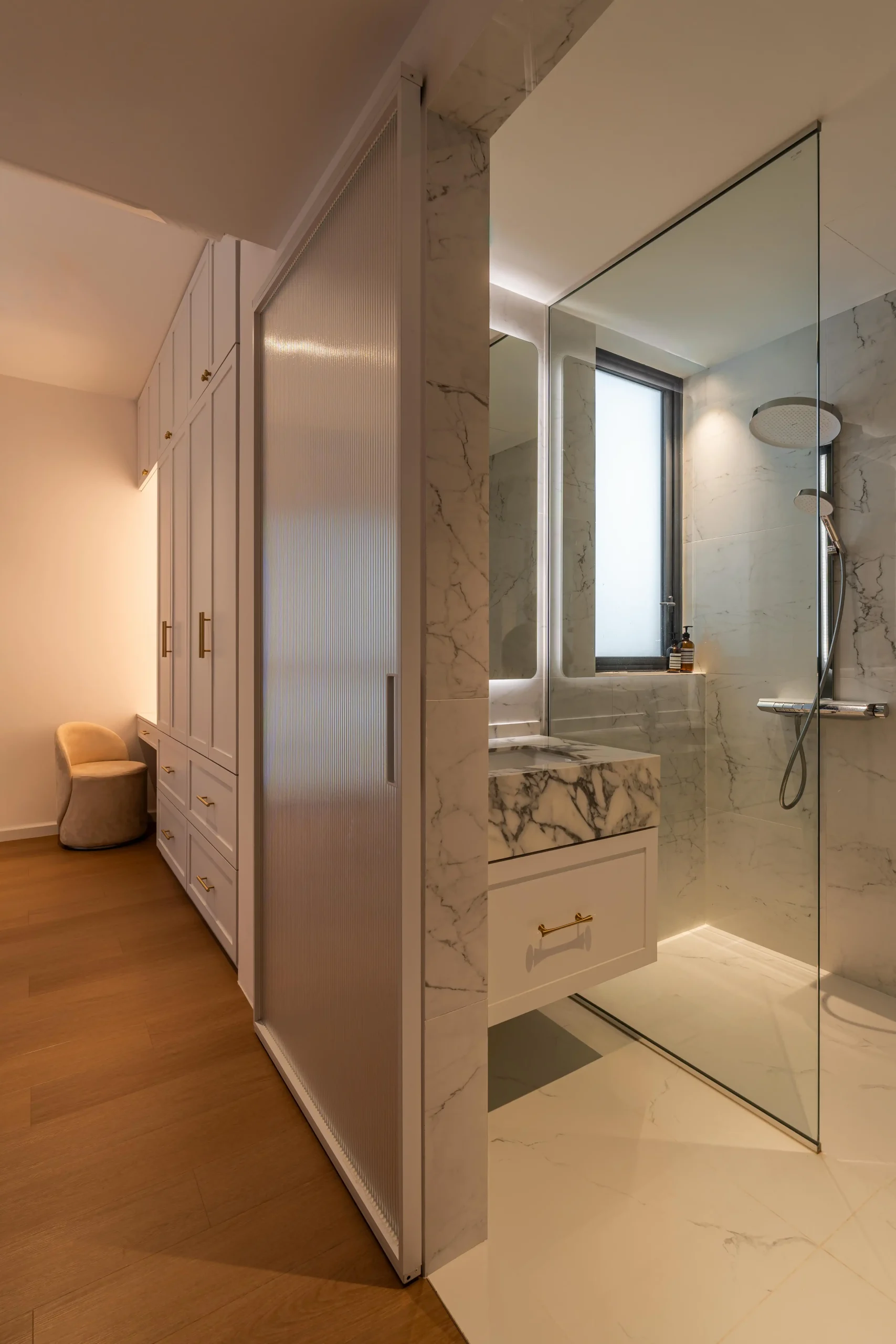 Bedroom cabinetry featuring custom built-in wardrobes with elegant detailing