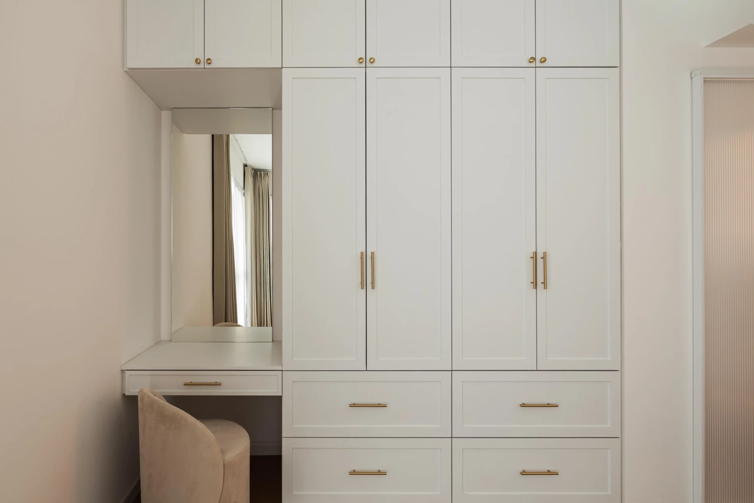 Modern Parisian bedroom with integrated wardrobe and vanity design