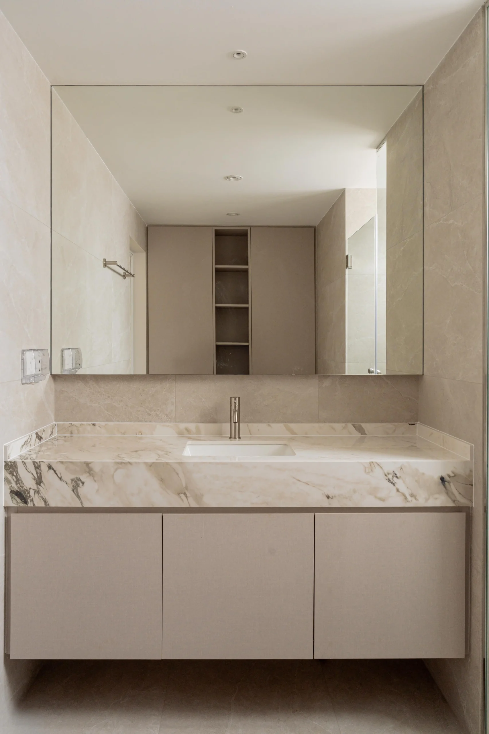 Minimalist bathroom sink with built-in storage and clean, functional under-vanity design