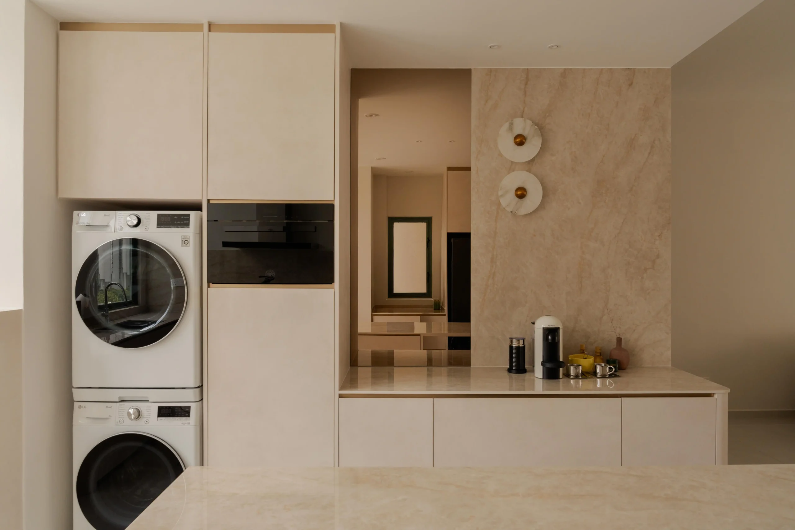 Minimalist laundry area with efficient storage and clean, organized layout